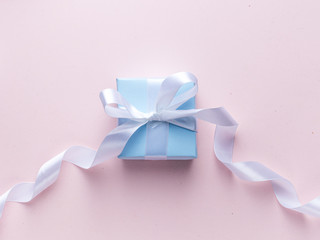 Blue gift box with white ribbon stock image.
