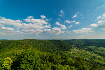 Fototapeta na wymiar Germany, Aerial scenic view above green valleys of swabian alb nature landscape from hohenneuffen mountain on sunny day in summer