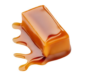 Sweet Caramel candies and melted caramel topping isolated on a white background..