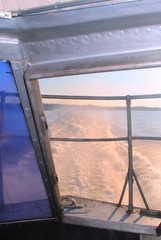 beautiful view from the boat window to the spray of sea foam