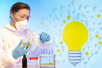 Fototapeta premium Microbiologist conducts experiments. Microbiologist near test tubes. Light bulb a symbol of innovation. Innovative technologies in manufacture of medicines. Innovations in development of probiotics