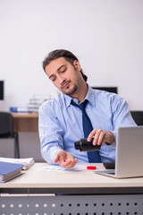 Fototapeta premium Sick male employee suffering at workplace