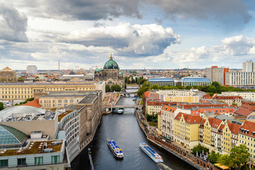Panoramic view of Berlin, Germany, showing historical landmark Berlin Cathedral (German: Berliner Dom ) and tour boats on the Spree River. © R.M. Nunes