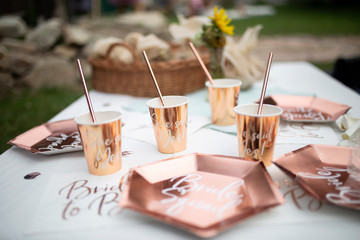 Four elegant stylish glasses with "she said yes" quote. Bachelorette party concept. Rose gold party decoration. 