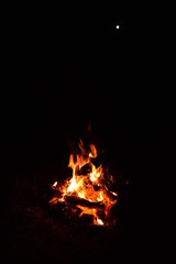 Fototapeta na wymiar The fire is burning in the dark of night