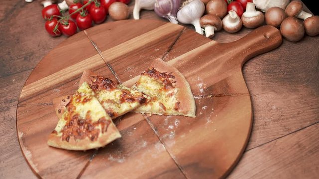 Throwing slices of pizza in 4K