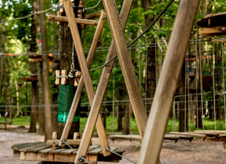 Fototapeta premium Rope park in a forest. Adventure summer park.