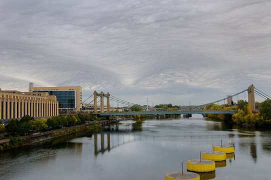 Hennepin Avenue suspension brdige over the Mississippi river at Minneapolis with Post Office and Federal Reserve Bank