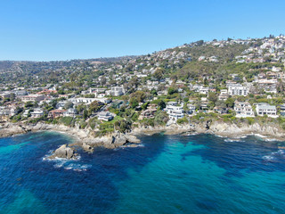 Aerial view of Laguna Beach coastline town with wealthy villas on the cliff, Southern California Coastline, USA