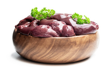 Raw pork liver in wooden bowl isolated on white
