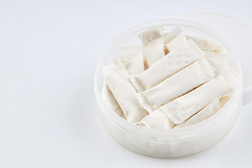 snus nicotine bags. chewing tobaсco product over white background. alternative to smoking cigarettes.