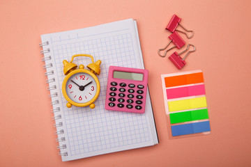 Obraz premium Creative flat lay. Back to school - school supplies on pink background.