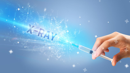 Syringe, medical injection in hand with X-RAY inscription, medical antidote concept