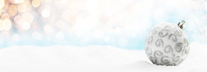 Christmas greeting card with decor in snow