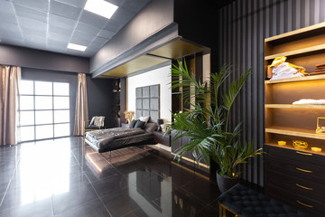 dark modern stylish male apartment interior with lighting, decorative walls, fireplace, dressing...