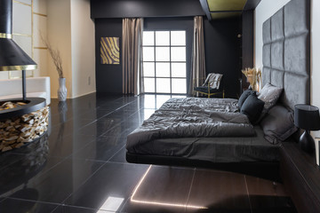 dark modern stylish male apartment interior with lighting, decorative walls, fireplace, dressing...