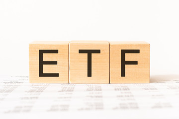 Word etf. Wooden small cubes with letters isolated on white background with copy space available.Business Concept image.