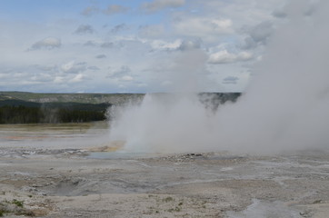 Late Spring in Yellowstone National Park: Clepsydra Geyser of the Fountain Group Erupts in Lower Geyser Basin