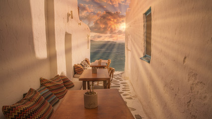 Benches with pillows in a typical Greek bar in Mykonos town with sea view, Cyclades islands, Greece. Travel concept. - obrazy, fototapety, plakaty