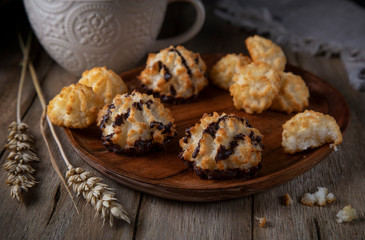 
Coconut cookies on a wooden plate