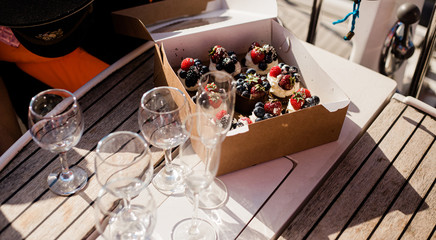 box with handmade berries cakes