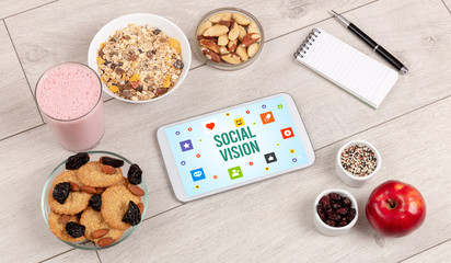 Healthy Tablet Pc compostion with SOCIAL VISION inscription, Social networking concept