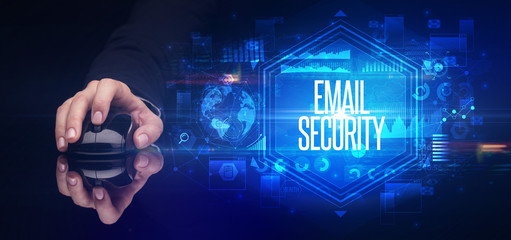 hand holding wireless peripheral with EMAIL SECURITY inscription, cyber security concept