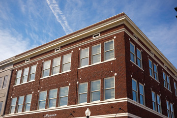 facade of an old building with blue sky © Zach