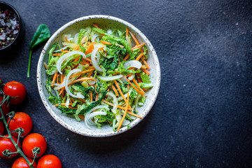 vegetables salad snack Peking savoy cabbage, onions, carrots, peppers and other vegetarian serving portion size natural product top view place for text copy space keto or paleo diet raw