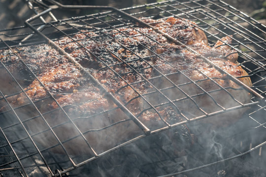chicken wrapped in clouds of white smoke, with a Golden crust cooking in the open air