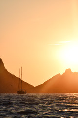 Sailing boat sailing during sunset