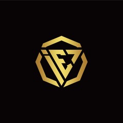 I E initial logo modern triangle and polygon design template with gold color