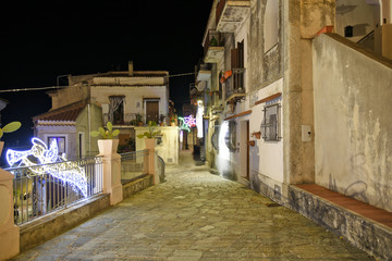A narrow street between the old houses of San Nicola Arcella, a village in the region of Calabria, Italy.