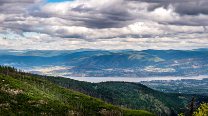 View of the city of Kelowna on the Shores of Lake Okanagan seen from the abandoned Kettle Valley Railway in Myra Canyon near Kelowna, British Columbia, Canada
