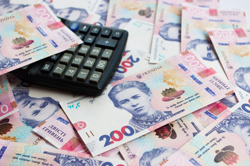 Background from two hundred hryvnias with calculator