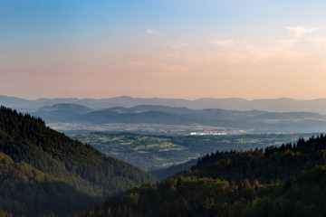 Obraz premium Panorama at sunset from the mountains of the Black Forest near Gersbach over the Wehratal and the city of Wehr towards the Swiss Alps