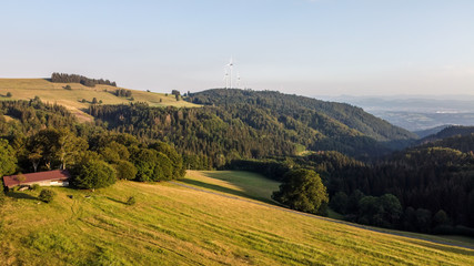 Fototapeta na wymiar Panorama at sunset from the mountains of the Black Forest near Gersbach over the Wehratal and the city of Wehr towards the Swiss Alps
