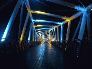 A lighted bridge at night