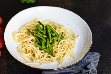 spaghetti green bean asparagus sauce cheese pasta second course vegetarian serving portion size natural product top view place for text copy space