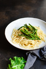 spaghetti green bean asparagus sauce cheese pasta second course vegetarian serving portion size natural product top view place for text copy space