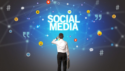 Rear view of a businessman with SOCIAL MEDIA inscription, social networking concept