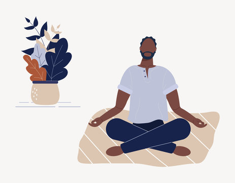 Midsection of biracial man practicing yoga meditation sitting in