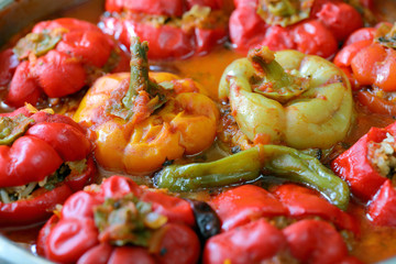 Stuffed bell peppers with meat and rice in tomato sauce, and spicy seasoning.