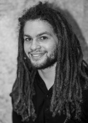 Monochrome Portrait of Young, White and Puerto Rican Male with long dreadlocks