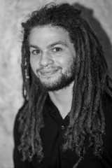 Black and White Portrait of a young man with long dreadlocks