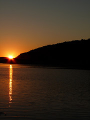 sunset on the lake with sunlights