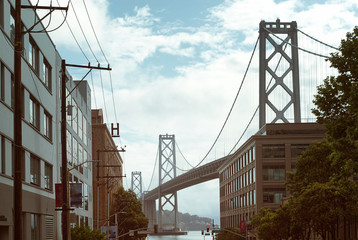 A San Francisco urban scape  of the Bay Bridge and surrounding  buildings near Rincon Hill.