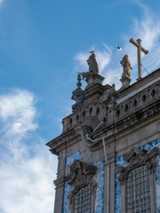 Fototapeta na wymiar Rear view of statues and pediment cross at church