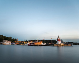Fototapeta na wymiar Pier at Vesijärvi Lake during sunset - Lahti. Finland