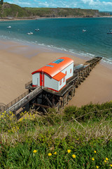 View from Tenby Wales UK of the coast and Carmarthen Bay in summer with old lifeboat station